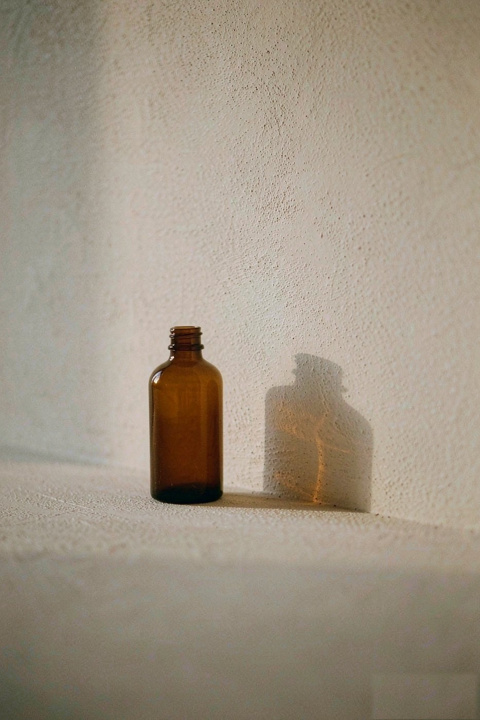 Amber glass bottle still life