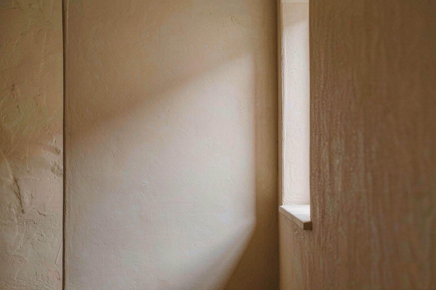 Minimal architectural corner with daylight